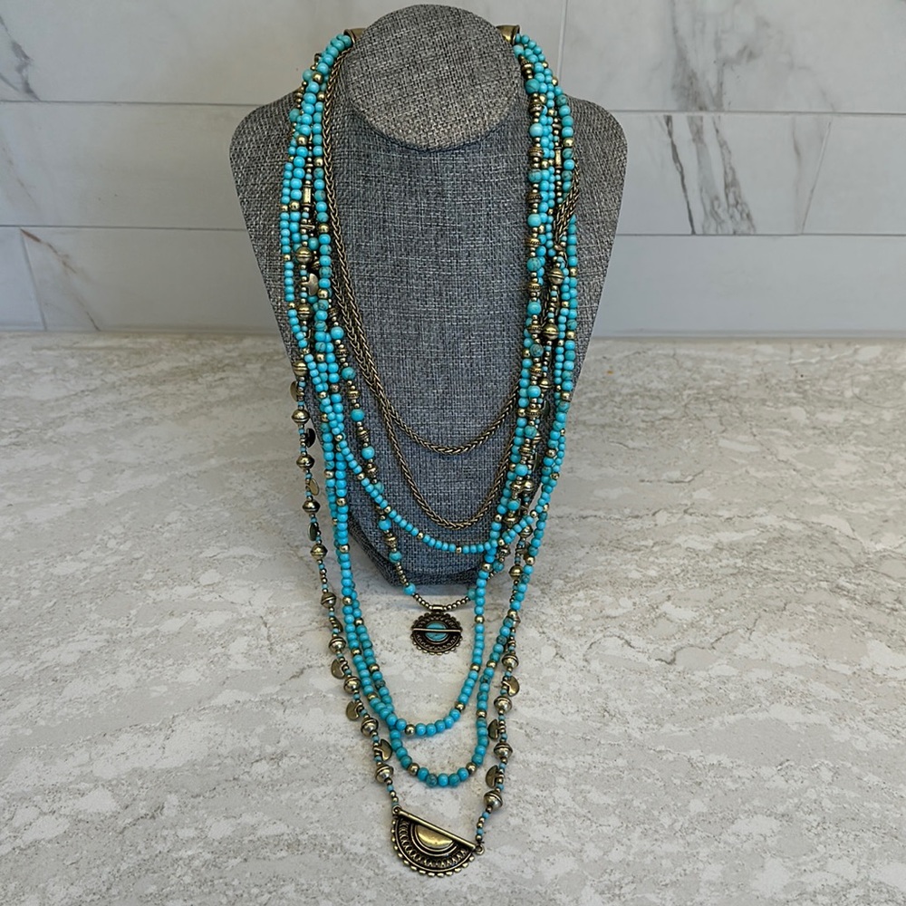 Cool aqua and gold multi strand beaded necklace.  Not too heavy.